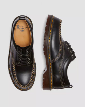 Dr. Martens Lowell zwart, bovenaanzicht met binnenzoollabel en zijaanzicht.
