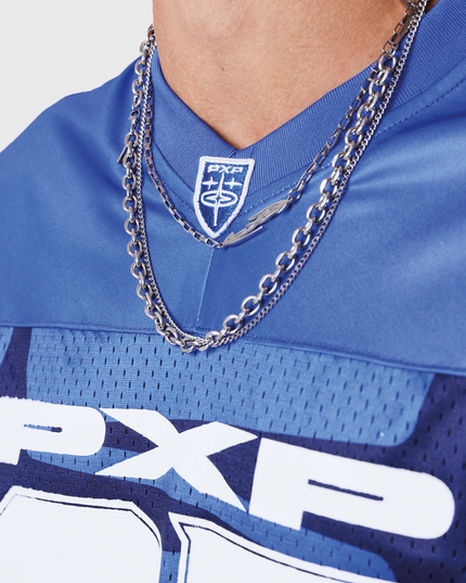 Project X Paris Jersey Blauw close up torso nek ketting logo pxp