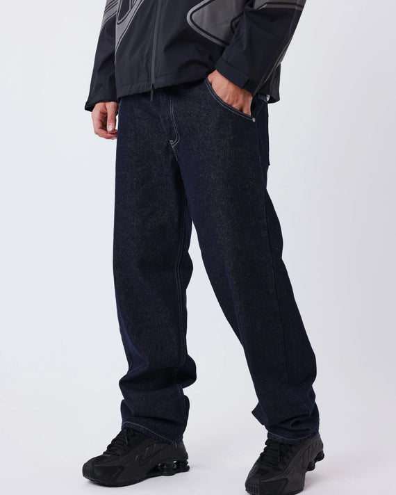Project X Paris Tag Stiksel Jeans, gedragen, close-up zijaanzicht met windjack.